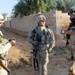 Iraqi army soldiers stand in lead during joint patrol