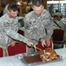 Soldiers give thanks for meal, buddy