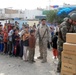 Regulars, Iraqi Army distribute meals to needy families in Sadr City