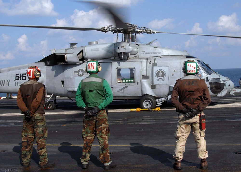 Gen. David H. Petraeus Departs USS Theodore Roosevelt