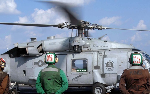Gen. David H. Petraeus Departs USS Theodore Roosevelt