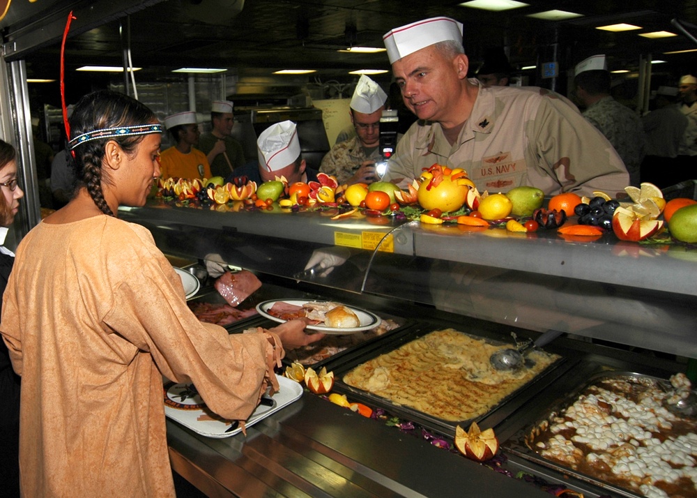 Chief of Supply Corps serves Thanksgiving dinner on USS Iwo Jima