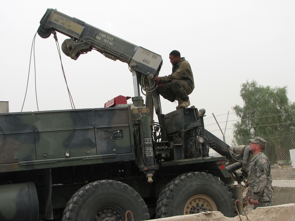 317th Maintenance Company Soldiers Prepare HEMMT Wrecker for Convoy Logistic Support Mission