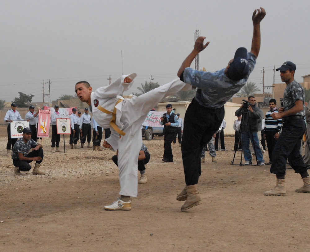 Sons of Iraq transition to Iraqi Polices during Furat Iraqi Police Graduation Ceremony