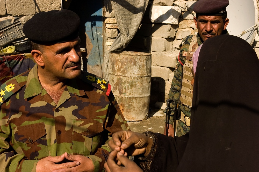 Iraqi army distributes heaters, clothing in Basra