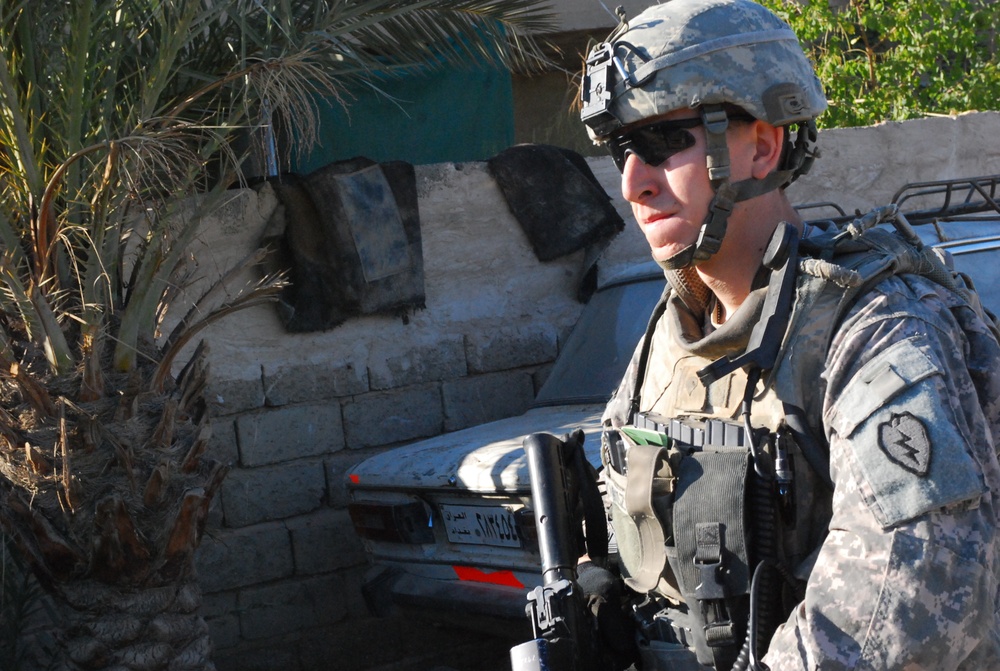 Iraqi Security Forces, Multi-National Division - Baghdad Soldiers patrols the neighborhood of Abu Ghuraib