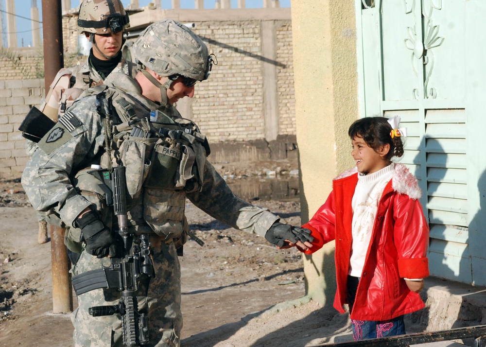 Iraqi Security Forces, Multi-National Division - Baghdad Soldiers patrols the neighborhood of Abu Ghuraib
