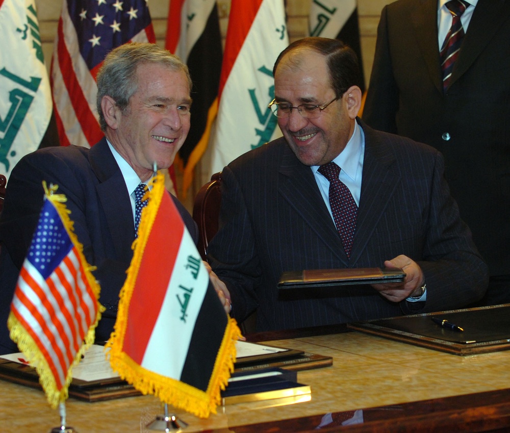 Bush visits Iraq, meets Maliki