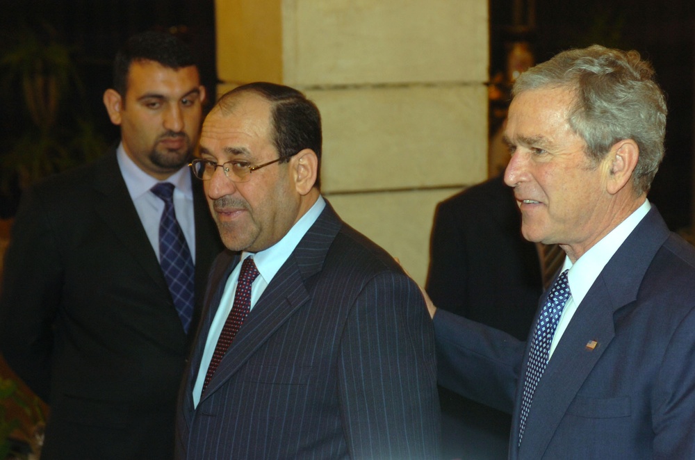Bush visits Iraq, meets Maliki