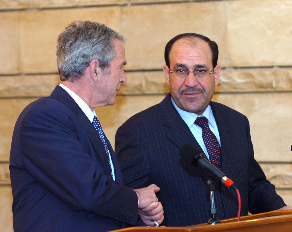 Bush visits Iraq, meets Maliki