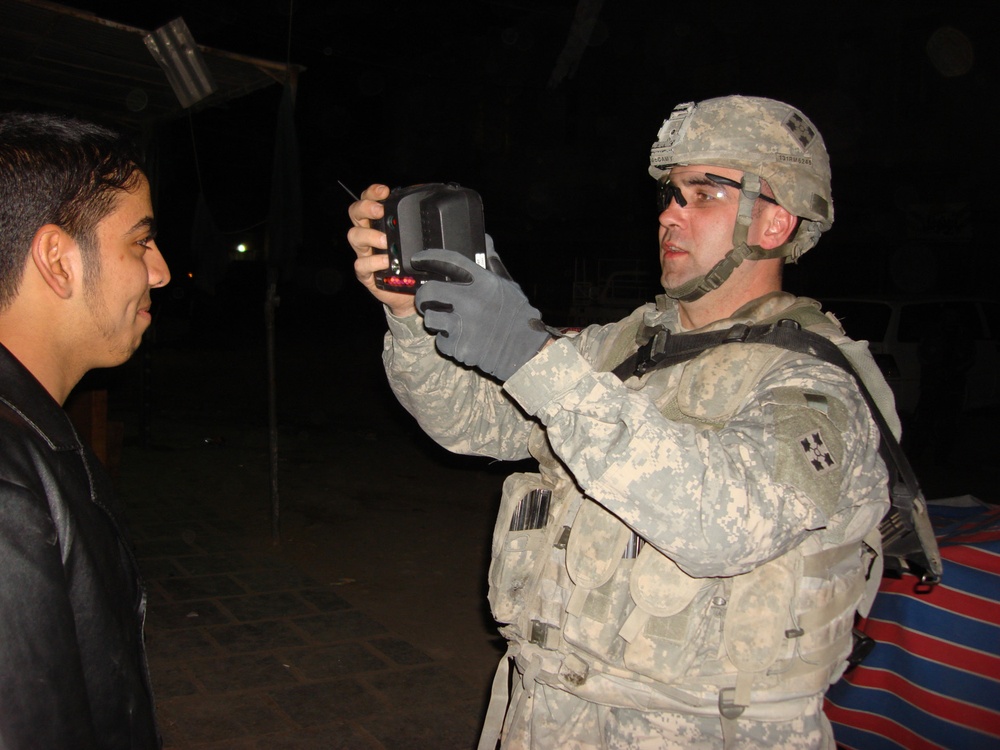 Soldiers use biometric technology to compile personal data