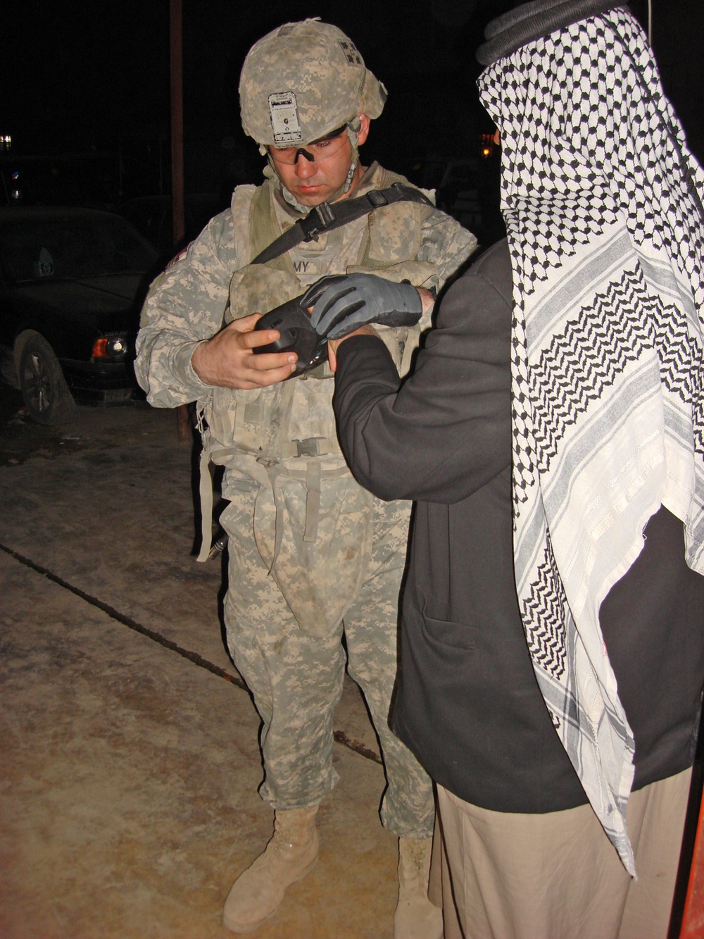 Soldiers use biometric technology to compile personal data