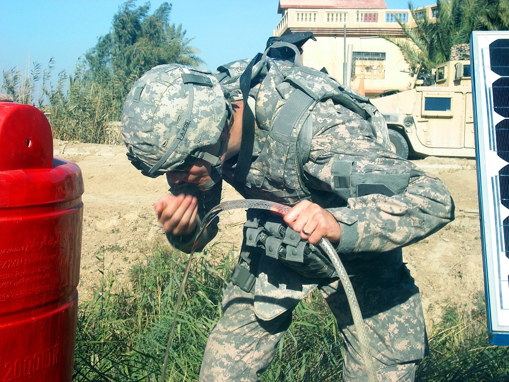 Multi-National Division- Baghdad Soldiers bring clean water to rural villages in Mahmudiyah