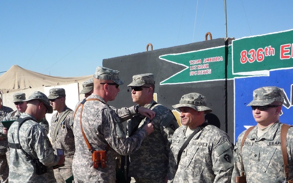 Medic treats Iraqi citizen on patrol