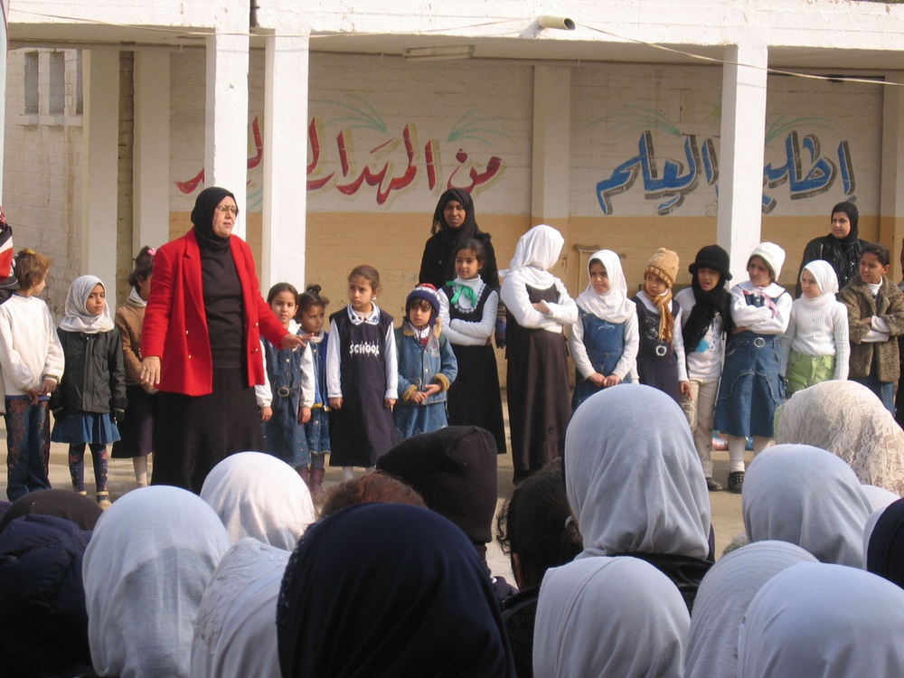 Soldiers provide assistance to girls of al-Nahareen school