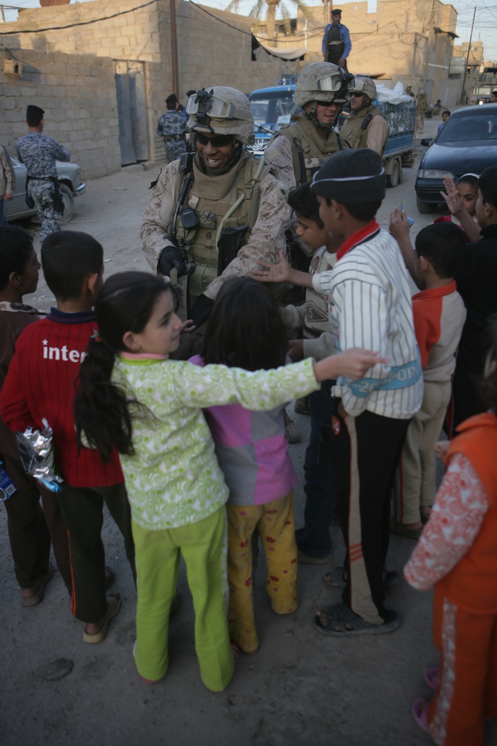 Iraqi police distribute candy, food in Andaloos precint