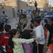 Iraqi police distribute candy, food in Andaloos precint
