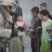 Iraqi police distribute candy, food in Andaloos precint