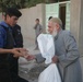 Iraqi police distribute candy, food in Andaloos precint