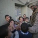 Iraqi police distribute candy, food in Andaloos precint