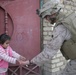 Iraqi police distribute candy, food in Andaloos precint