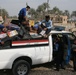 Iraqi police distribute blankets, heaters in Ramadi