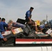 Iraqi police distribute blankets, heaters in Ramadi