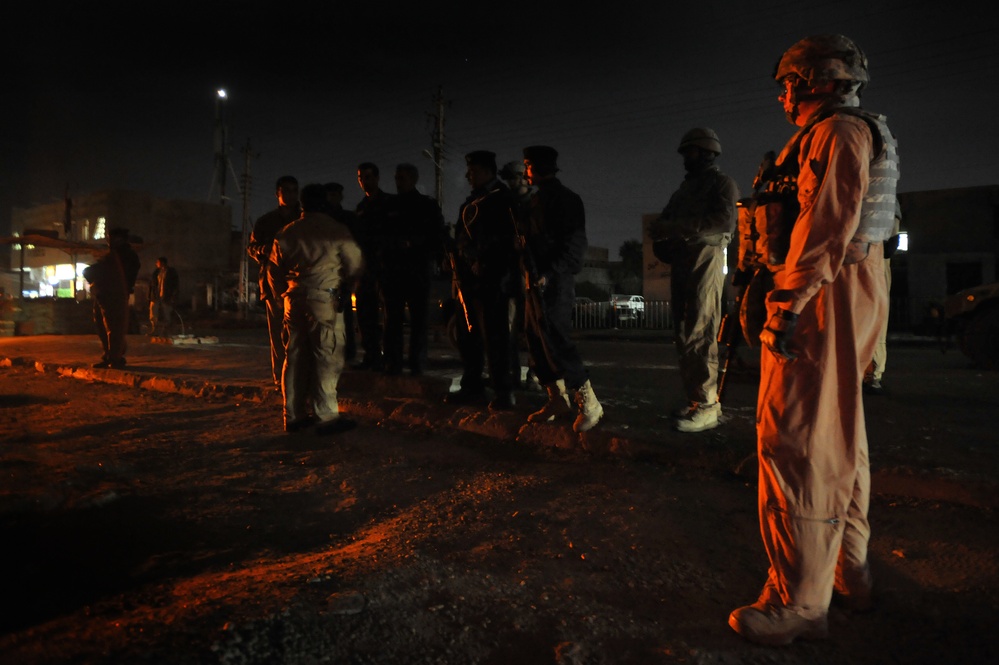 USAF Police patrol in Doura community