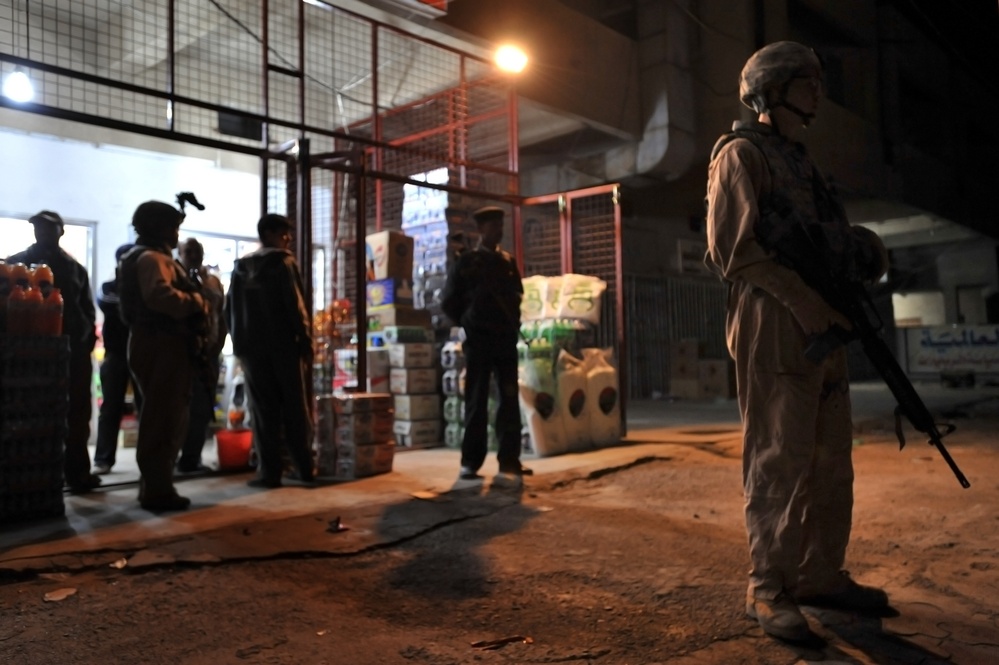 USAF Police patrol in Doura community