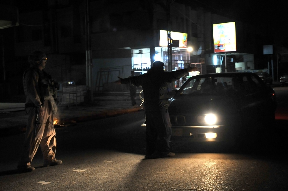 USAF Police patrol in Doura community