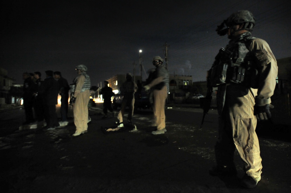 USAF Police patrol in Doura community