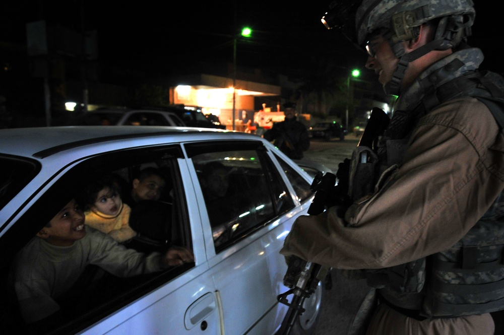 USAF Police patrol in Doura community