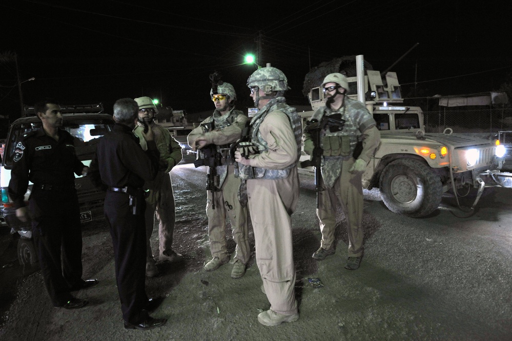 USAF Police patrol in Doura community