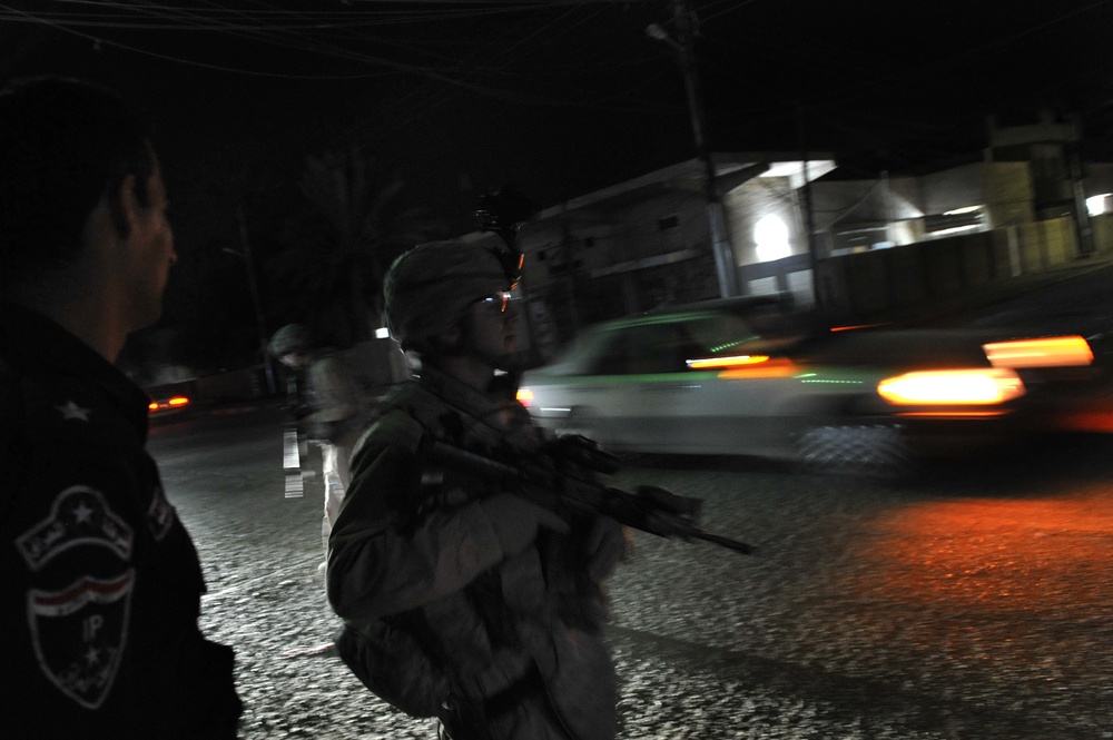 USAF Police patrol in Doura community