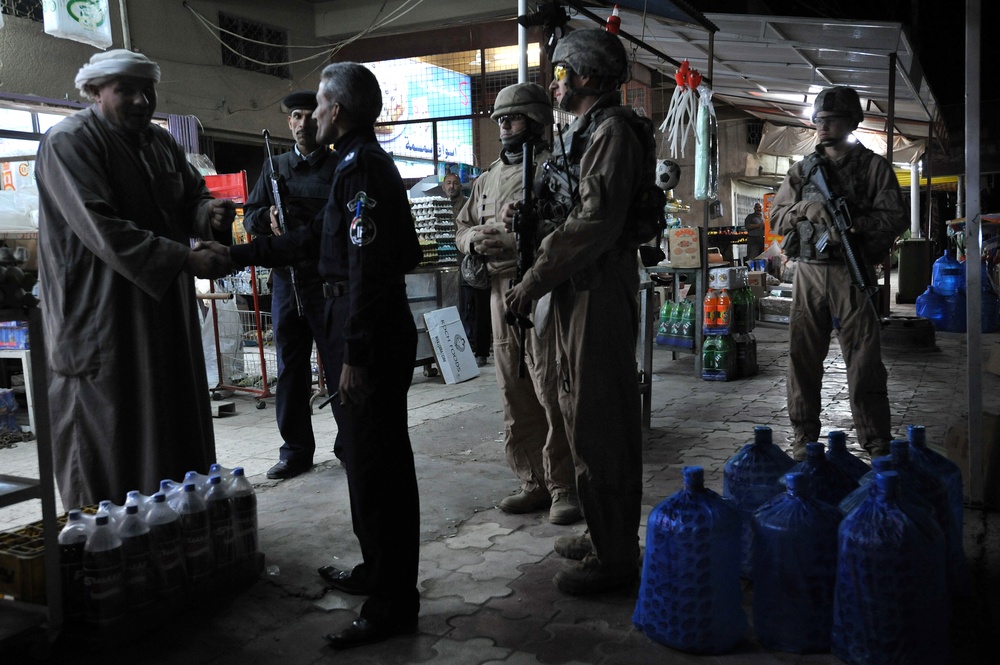 USAF Police patrol in Doura community