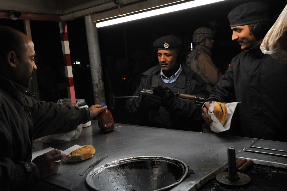 USAF Police patrol in Doura community