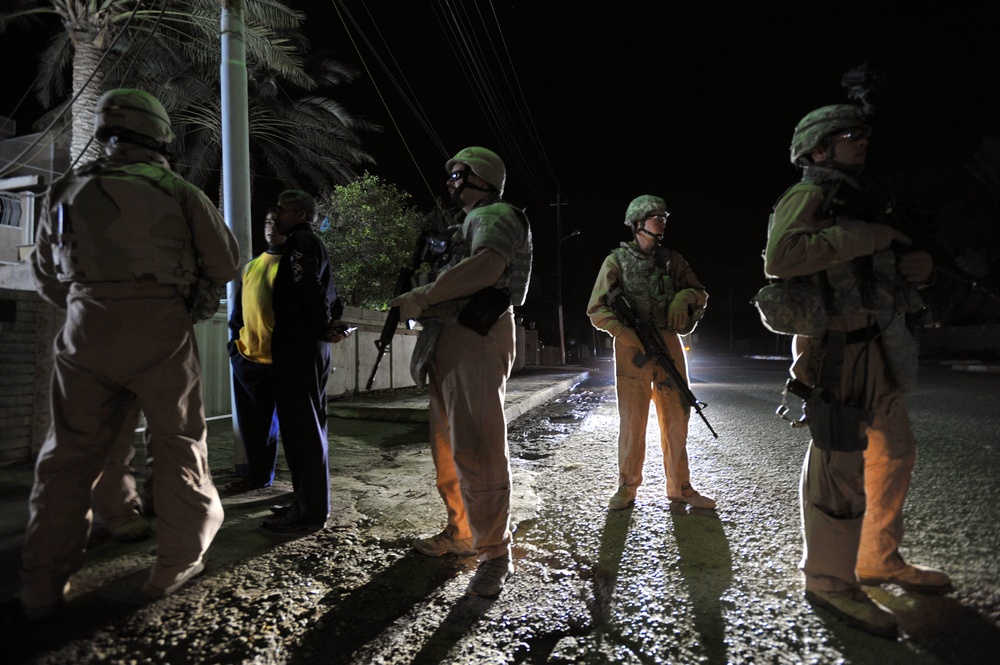 USAF Police patrol in Doura community