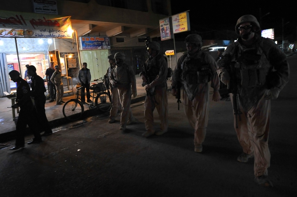 USAF Police patrol in Doura community