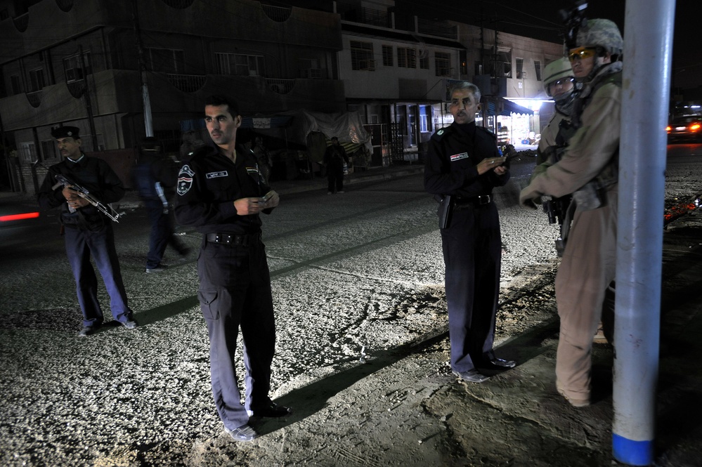 USAF Police patrol in Doura community