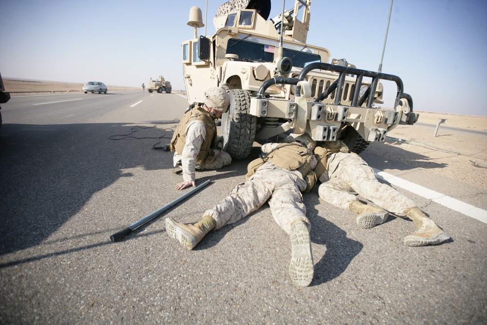 Security Marines change tire during mission