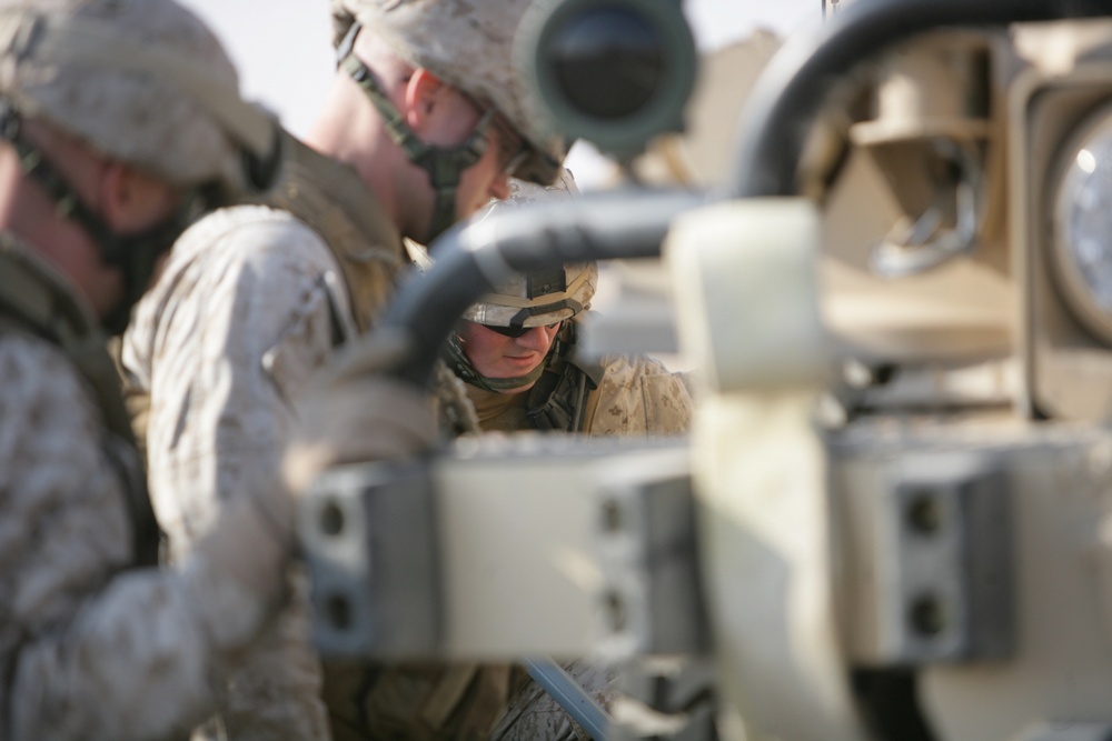 Security Marines change tire during mission