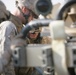 Security Marines change tire during mission