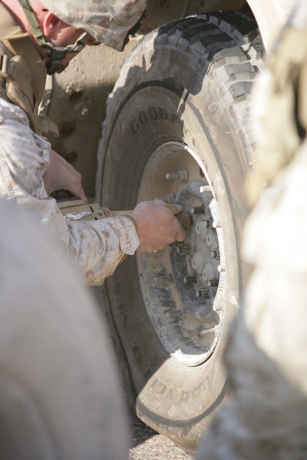 Security Marines change tire during mission