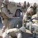 Security Marines change tire during mission