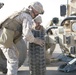 Security Marines change tire during mission