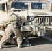 Security Marines change tire during mission