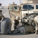 Security Marines change tire during mission