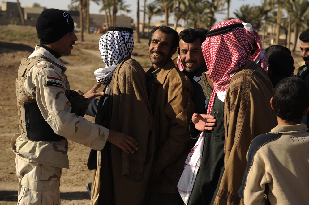 Meet with Sheiks and hand out supplies in Shinafiyah Iraq