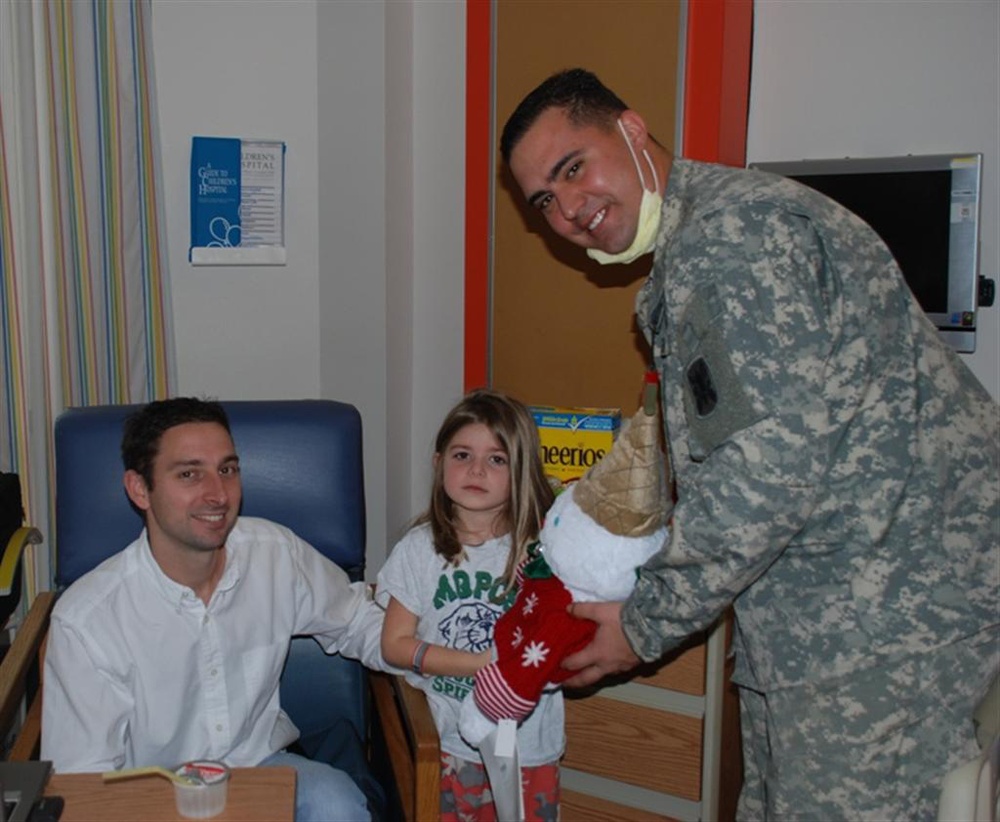 Soldiers bring Christmas spirit to ailing children