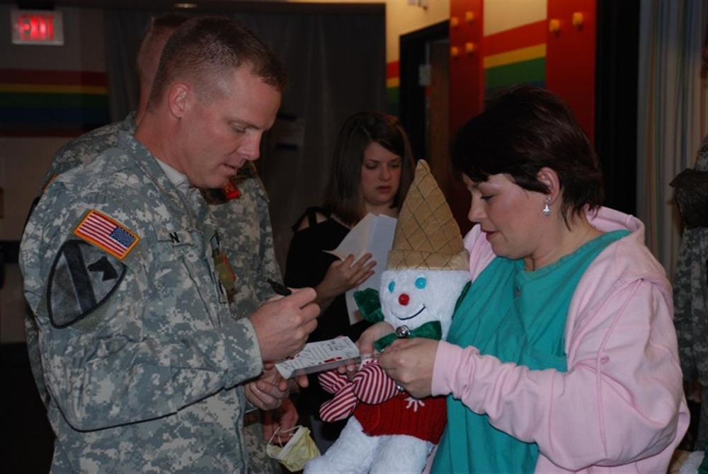 Soldiers bring Christmas spirit to ailing children